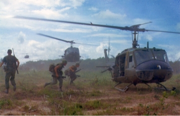 An image of a uniformed persons getting into helicoptors